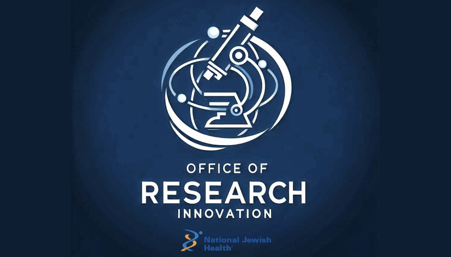 Researcher looking through a microscope