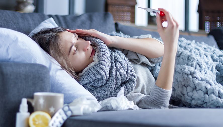 sick woman on couch