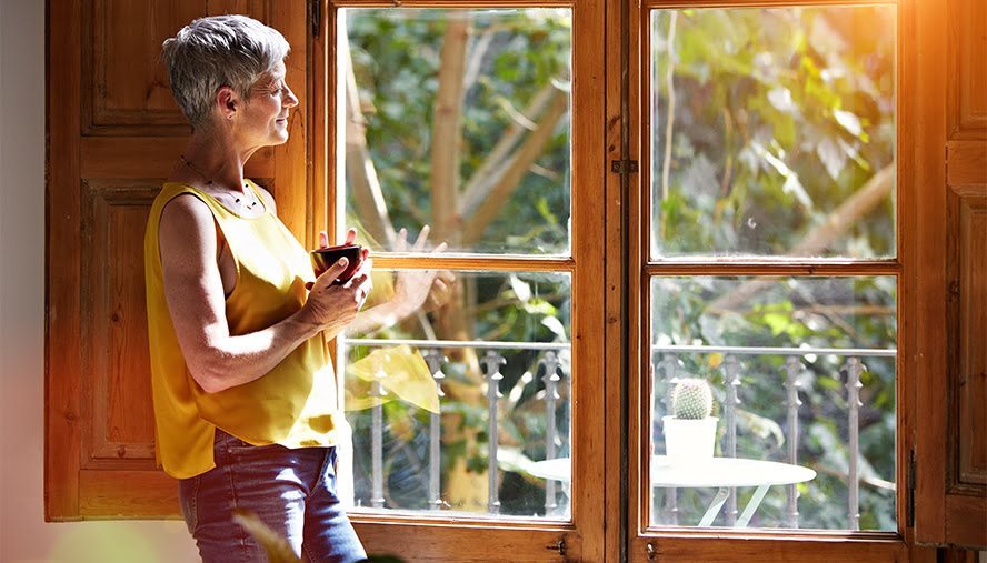 woman by window