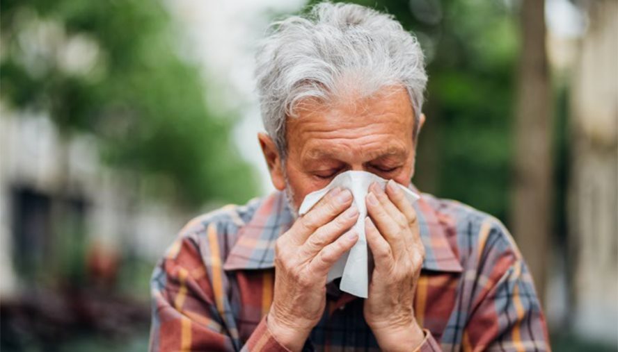 man sneezing