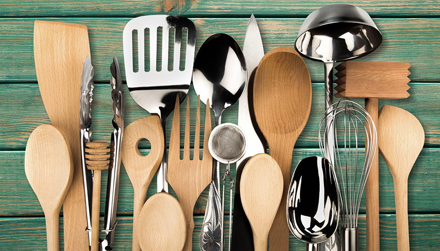 Kitchen utensils like spatulas, soup ladles, whisks, and scoops.