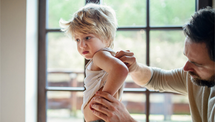 Child being examined for allergic reaction