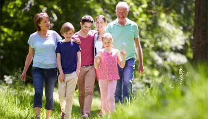 Family walking through a field