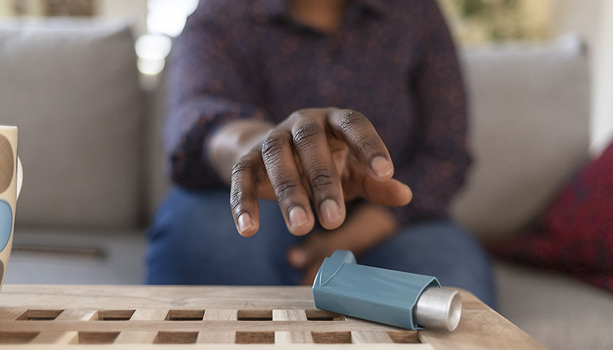 Hand reaching for a nebulizer