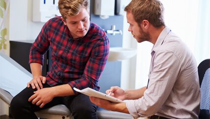 physician and patient reviewing medical history