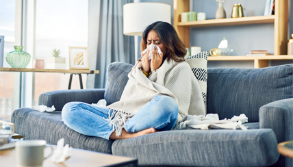 COVID-19 (Coronavirus) & Allergies: Woman sneezing